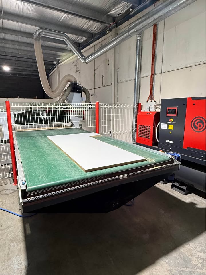 CNC machine cutting cabinet panels